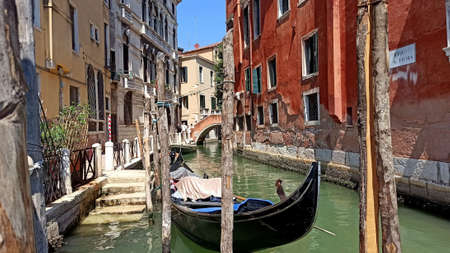 Venice, Italy - December 6, 2020: Gondoleer on the canals after ride.の写真素材