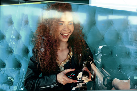 young redhead girl playing fps shooter game and smiling. Double exposure photo with gun on screen