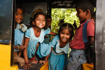 23 february 2018 Madurai, India, group of indian schoolgirls smiling to camera in tuk tuk rickshawのeditorial素材