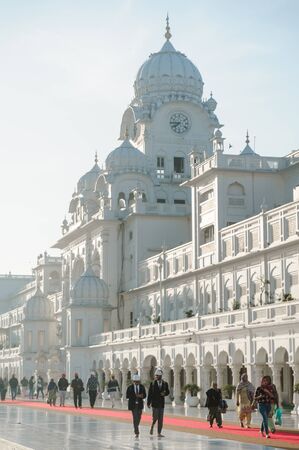 crowd of indian pilgrim and tourists waliking along golden temple. 26 february 2018 Amritsar, India.のeditorial素材