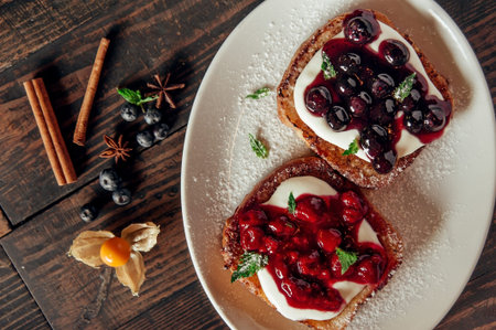 sweet toast with berry jam at dark wood background