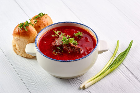 borsch with pampushkas, lard and onion at white table top. borsch is traditional ukrainian cuisine...
