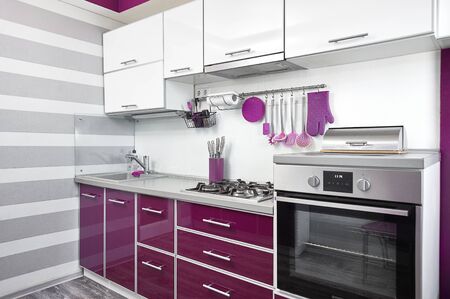 kitchen interior in purple, white and gray colours. Trendy ultraviolet kitchen room design. Modern home interiorの写真素材