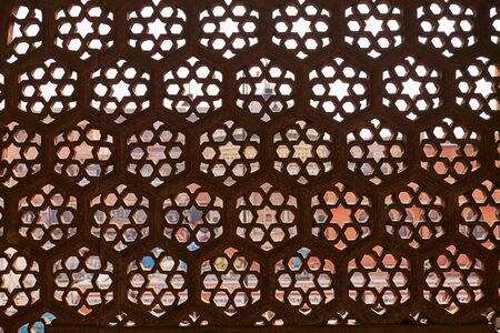 Indian or arabic window pattern. Window with many holesの写真素材