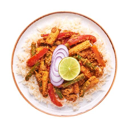 Vegetable Jalfrezi with basmati rice isolated on white background. Jalfrezi is Indian Cuisine dish with stir fried vegetables and tomato-nuts gravy with spices. Indian Food. Top viewの写真素材