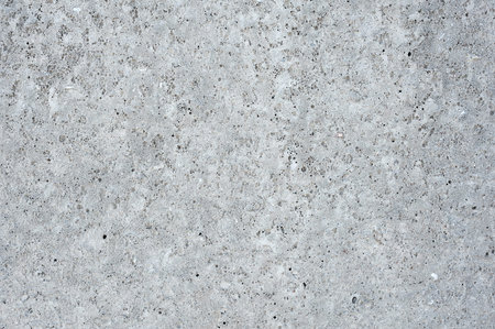 Grey wall texture. Porous concrete wall of buildingの写真素材