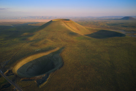 Aerial landscape of volcanic crater in Turkey. Stunned view of green valley with mountains and...