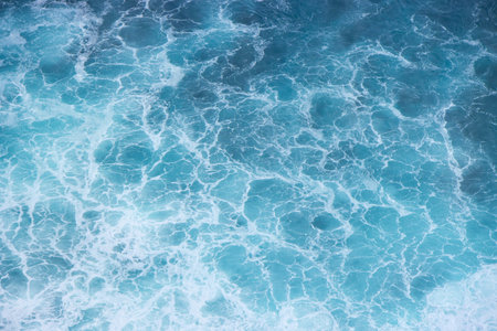 Blue stormy and wavy ocean water surface.の写真素材