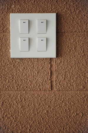 Four Switch on brick wall