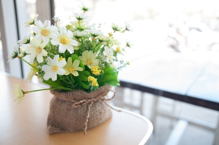 Sunny morning with flowers in cafeの写真素材