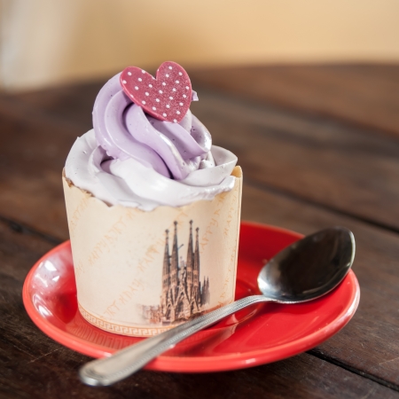 Try to eat a cupcake, then you will appreciate this の写真素材