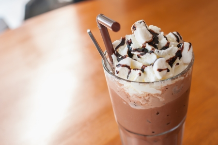 Iced cocoa and whipped cream topped with chocolateの写真素材