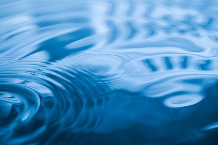 Rings on a water surface caused by a falling drop.