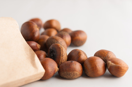 Sweet chestnuts spilled out from the papar bagの写真素材