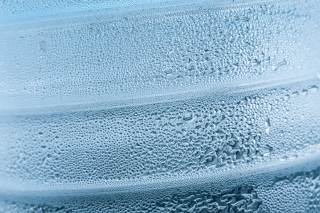 fresh background of water drops on blue surfaceの写真素材