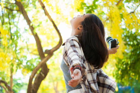 Leisure activities of girl photographer in fine weatherの写真素材