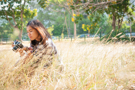 Leisure activities of girl photographer in fine weatherの写真素材