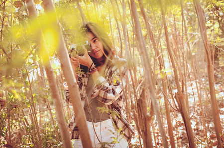 Leisure activities of girl photographer in fine weather with cross processed retro effectの写真素材