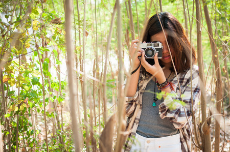 Leisure activities of girl photographer in fine weatherの写真素材