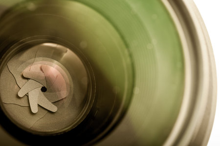 The diaphragm of a camera lens aperture. Selective focus with shallow depth of field. Color toned...