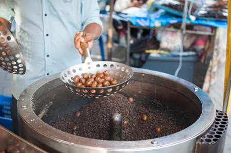 One more step to cooking sweet chestnuts in Thailandの写真素材
