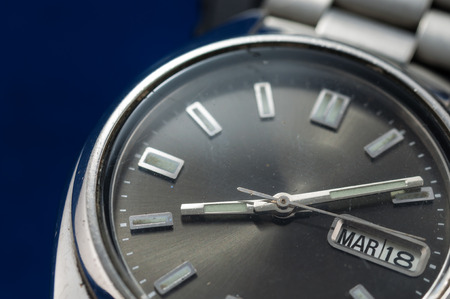 Closeup of classic watch on blue backgroundの写真素材
