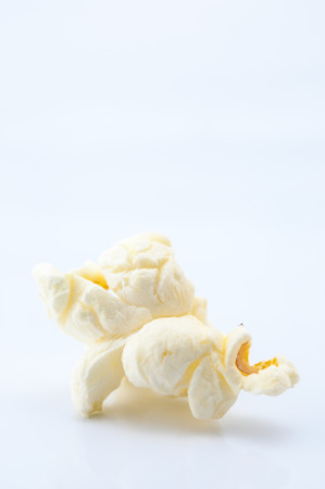 Closeup of popcorn on white backgroundの写真素材