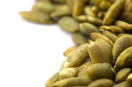 Pumpkin seeds isolated on white background, Close-up shotの写真素材