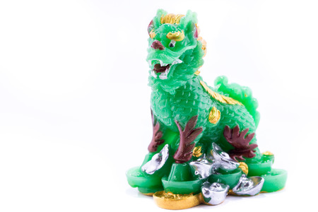 Chinese jade lion statue isolated on white backgroundの写真素材