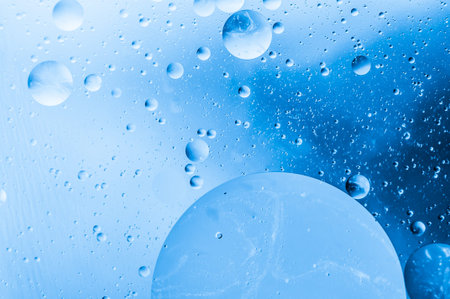 Macro bubbles of water on blue background