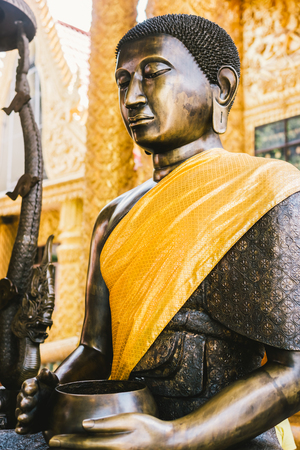 Buddha statue in a thailane templeの写真素材