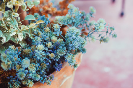 Artificial flowers in a pot decorate on garden, Color Effect.