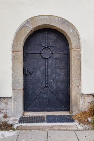 Hand-wrought historic metallic door of the Templar defense church. Bohemiaの写真素材
