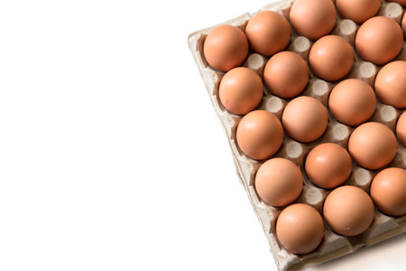 chicken eggs, packaged, eggs placed on a white background, eggs outside the packageの写真素材