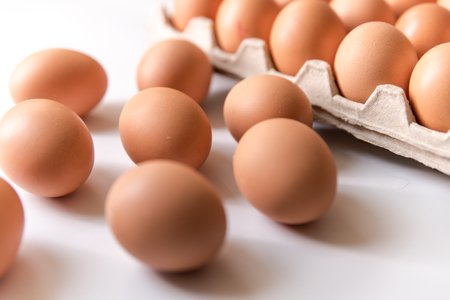 chicken eggs, packaged, eggs placed on a white background, eggs outside the packageの写真素材