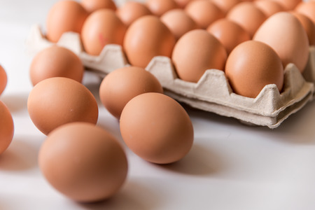 chicken eggs, packaged, eggs placed on a white background, eggs outside the packageの写真素材