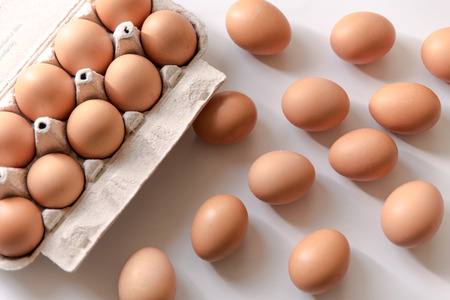 chicken eggs, packaged, eggs placed on a white background, eggs outside the packageの写真素材