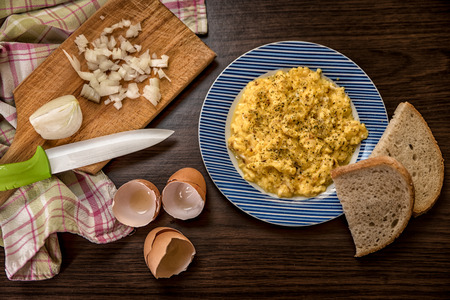 Mixed egg with onion served with bread on plate, Top view, Indigestionの写真素材
