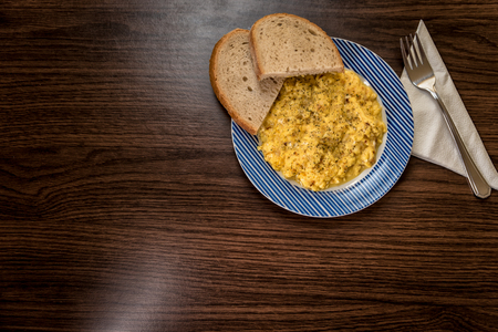 Mixed egg with onion served with bread on plate, Top view, Indigestionの写真素材