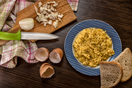 Mixed egg with onion served with bread on plate, Top view, Indigestionの写真素材