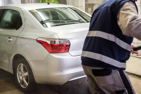 washing cars with pressurized water, washing with foam and water, car washの写真素材