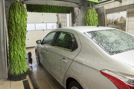 washing cars with pressurized water, washing with foam and water, car washの写真素材