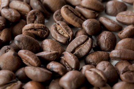 Roasted coffee beans, coffee and background, top view, on wooden backgroundの写真素材
