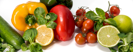 fresh raw vegetables, salad preparation, pepper, tomatoes, cucumber, fresh salad, lime, lemon, cheeseの写真素材