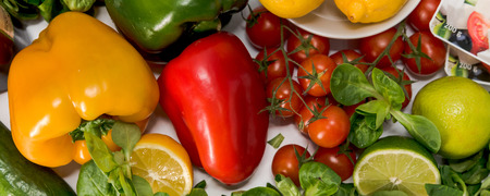 fresh raw vegetables, salad preparation, pepper, tomatoes, cucumber, fresh salad, lime, lemon, cheeseの写真素材
