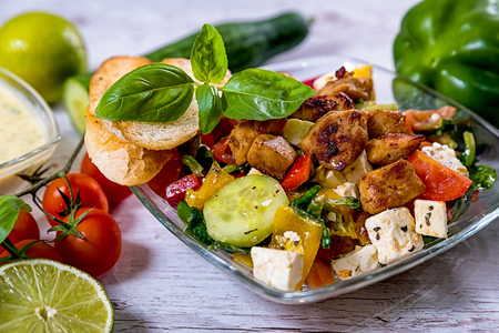 salad, Greek, Italian, tomato mozzarella Basil leaves, peppercorn and olive oil on a wooden table. Recipe - Compositionの写真素材