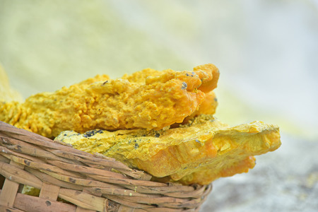 Sulfur in the basket from Kawah Ijen volcano crater, East Java, Indonesiaの写真素材