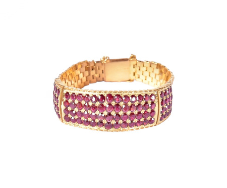 Gold bracelet with ruby gems on a white backgroundの写真素材