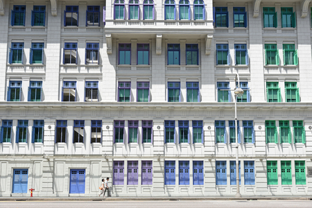 SINGAPORE - JANUARY 04: MICA building on January 04, 2015 in Singapore. It was known as the Old Hill Street Police Station. This building has a total of 927 windows and are painted in the rainbow color.のeditorial素材