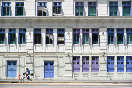 SINGAPORE - JANUARY 04: MICA building on January 04, 2015 in Singapore. It was known as the Old Hill Street Police Station. This building has a total of 927 windows and are painted in the rainbow color.のeditorial素材